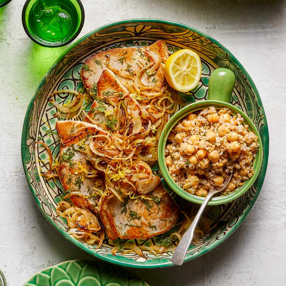 <p>This healthy tuna recipe combines fresh fish, olive oil, lemon juice, fresh herbs and chickpeas. Cooking for two? Flake the two leftover tuna steaks and mix them into the remaining bulgur salad, then serve over lettuce for lunch the next day.</p> <p> <a href="https://www.eatingwell.com/recipe/274832/seared-tuna-with-bulgur-chickpea-salad/" rel="nofollow noopener" target="_blank" data-ylk="slk:View Recipe;elm:context_link;itc:0;sec:content-canvas" class="link ">View Recipe</a></p>