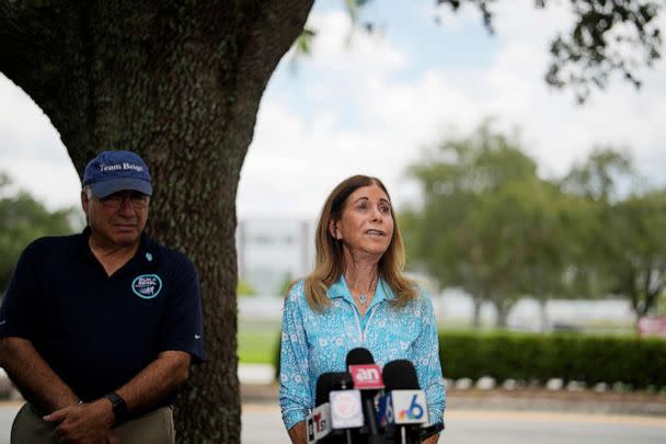 PHOTO: Linda Beigel Schulman, mother of Scott Beigel, is overcome with emotion as she talks to journalists about visiting the scene where her son and 16 others were killed, at Marjory Stoneman Douglas High School in Parkland, Fla., July 5, 2023. (Rebecca Blackwell/AP)