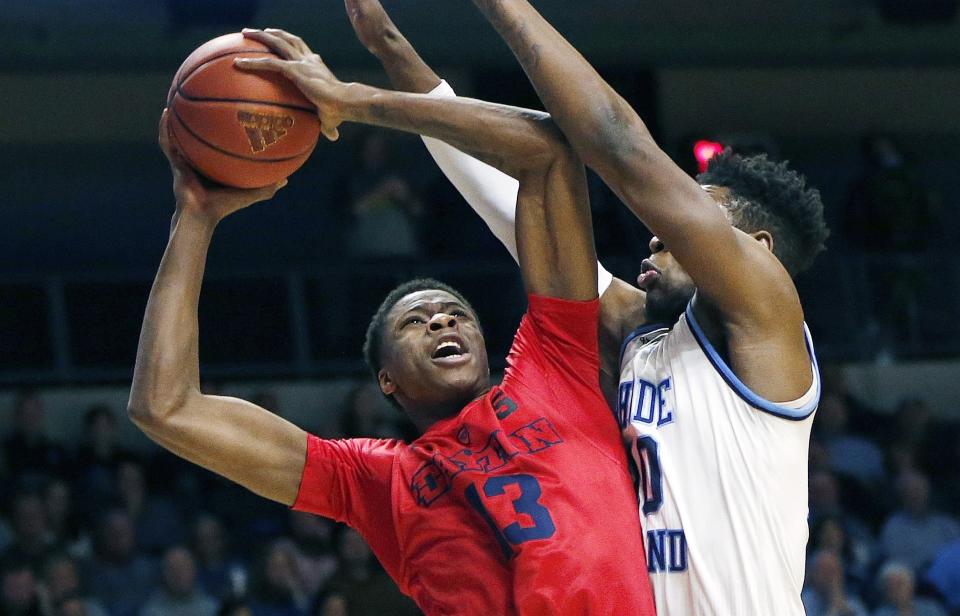 Dayton’s Kostas Antetokounmpo (13) goes up to shoot against Rhode Island’s Cyril Langevine (10) during the first half of an NCAA college basketball game in South Kingstown, R.I., Friday, Feb. 23, 2018. (AP Photo/Michael Dwyer)