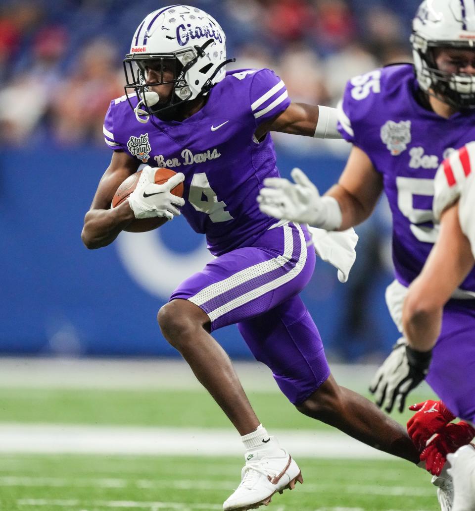 Ben Davis Giants Mark Zackery (4) rushes up the field Saturday, Nov. 25, 2023, during the IHSAA Class 6A football state championship game at Lucas Oil Stadium in Indianapolis. The Ben Davis Giants lead at the half against the Crown Point Bulldogs, 10-3.