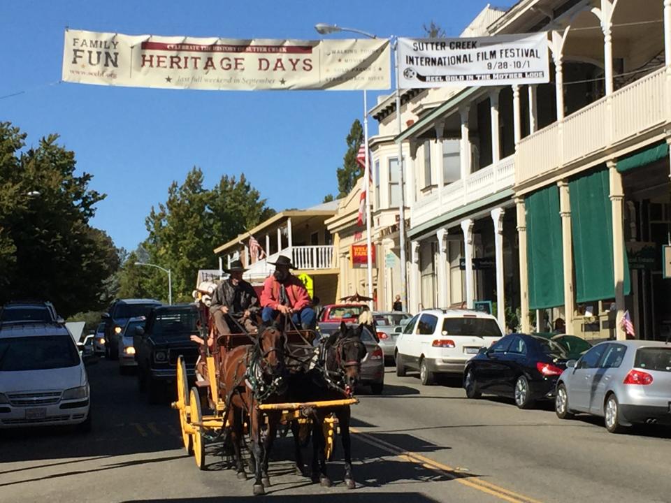 A Wells Fargo Stagecoach thunders down Sutter Creek’s historic Main Street, lined with 19th century architecture, shops, wine-tasting, restaurants.