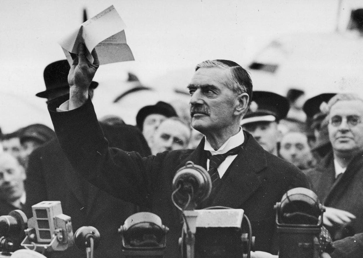 <span class="caption">'Peace for our time': British prime minister Neville Chamberlain displaying the Anglo-German declaration, known as the Munich Agreement, in September 1938.</span> <span class="attribution"><a class="link " href="https://commons.wikimedia.org/wiki/File:Munich_Agreement_(M%C3%BCnchener_Abkommen)_1938-09-30_Neville_Chamberlaine_showing_the_Anlo-German_declaration_(%22Peace_for_our_time%22)._Heston_Aerodrome,_west_of_London,_England._Narodowe_Archiwum_Cyfrowe_3_1_0_5_268_3_1_111334_No_known_cop.jpg" rel="nofollow noopener" target="_blank" data-ylk="slk:Wikimedia;elm:context_link;itc:0;sec:content-canvas">Wikimedia</a>, <a class="link " href="http://creativecommons.org/licenses/by-sa/4.0/" rel="nofollow noopener" target="_blank" data-ylk="slk:CC BY-SA;elm:context_link;itc:0;sec:content-canvas">CC BY-SA</a></span>