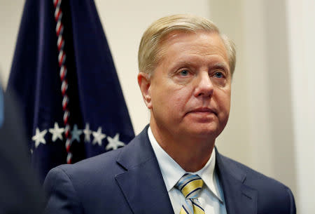 FILE PHOTO: Sen. Lindsey Graham (R-SC) waits for U.S. President Donald Trump to enter the room to speak about the "First Step Act" in the Roosevelt Room at the White House in Washington, U.S. November 14, 2018. REUTERS/Leah Millis/File Photo