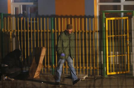 A forensic personnel walks in front of a betting shop after an attack in Sarajevo, November 19, 2015. Two soldiers of the Bosnian army were shot dead late on Wednesday when an attacker opened a fire from an automatic weapon at the betting shop near the army barracks at the periphery of the capital Sarajevo. Witnesses at the scene said the attacker appeared to be a follower of the ultra-conservative Salafi Muslim movement in Bosnia, but Nefic could not confirm the reports. REUTERS/Dado Ruvic