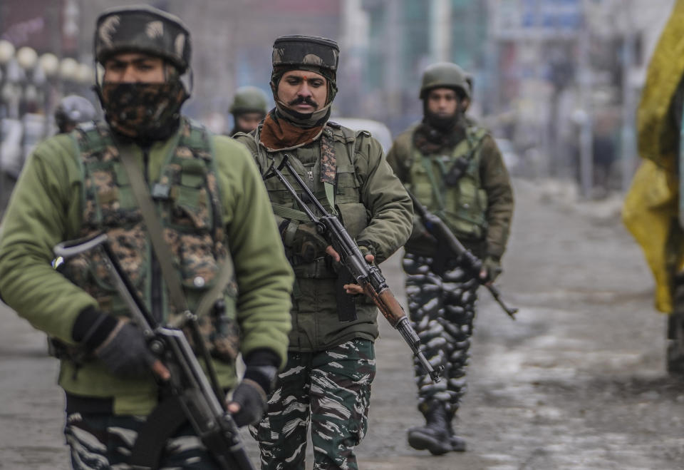 Indian soldiers patrol a closed market on Republic Day in Srinagar, Indian controlled Kashmir, Thursday, Jan. 26 , 2023. The day marks the anniversary of the adoption of the country’s constitution on Jan. 26, 1950, nearly three years after it won independence from British colonial rule. (AP Photo/Mukhtar Khan)