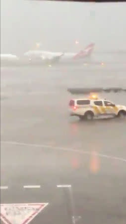 A Qantas plane takes off during heavy rains in Sydney, New South Wales, Australia November 28, 2018 in this still image taken from a video obtained from social media. Adem Yaglipnar/via REUTERS