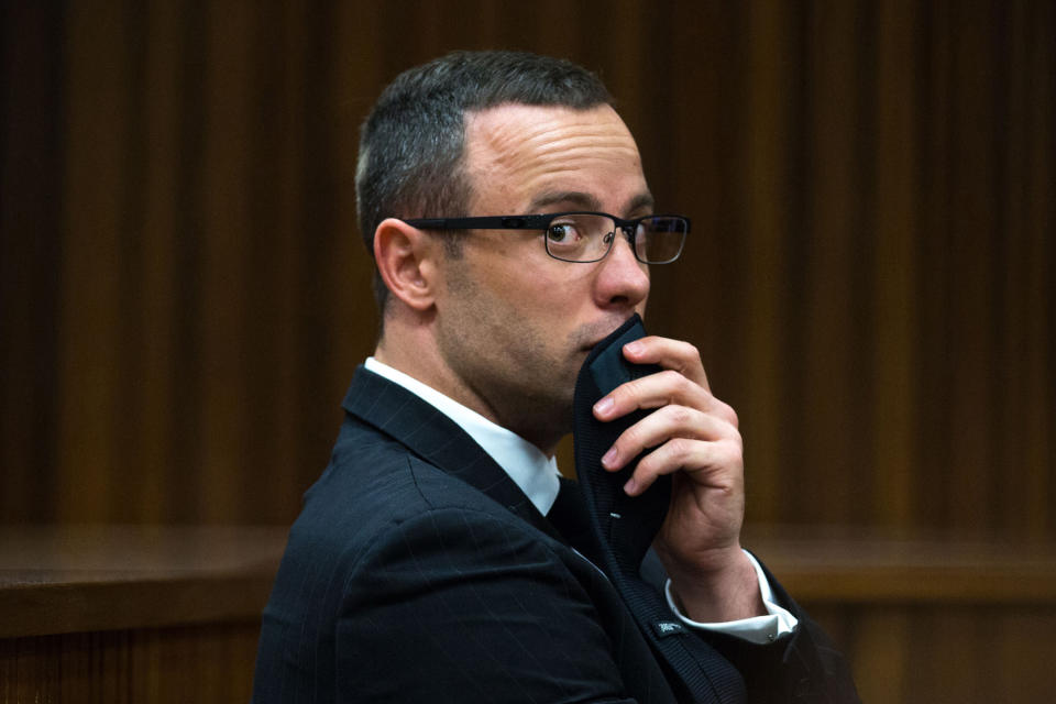 Oscar Pistorius, gestures, as he listens to psychiatric evidence for his defense, during his ongoing murder trial in Pretoria, South Africa, Tuesday, May 13, 2014. The chief prosecutor in the murder trial of Oscar Pistorius has asked that the double-amputee runner be placed under psychiatric evaluation after an expert witness testified that he had an anxiety disorder. Pistorius is charged with the shooting death of his girlfriend Reeva Steenkamp on Valentine's Day in 2013. (AP Photo/Daniel Born, Pool)