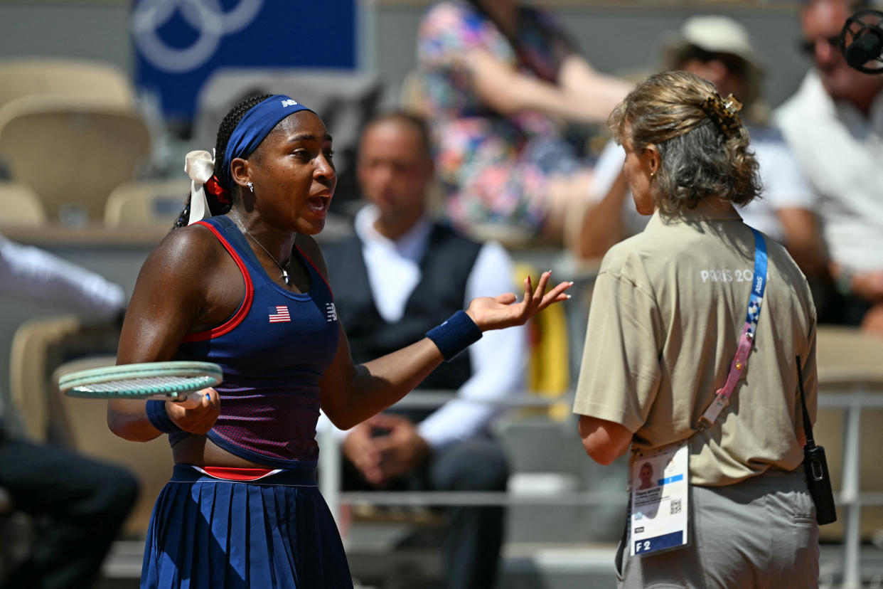 US' Coco Gauff speaks with an official after a call goes against her while playing Croatia's Donna Vekic during their women's singles third round tennis match on Court Philippe-Chatrier at the Roland-Garros Stadium during the Paris 2024 Olympic Games, in Paris on July 30, 2024. (Photo by PATRICIA DE MELO MOREIRA / AFP) (Photo by PATRICIA DE MELO MOREIRA/AFP via Getty Images)