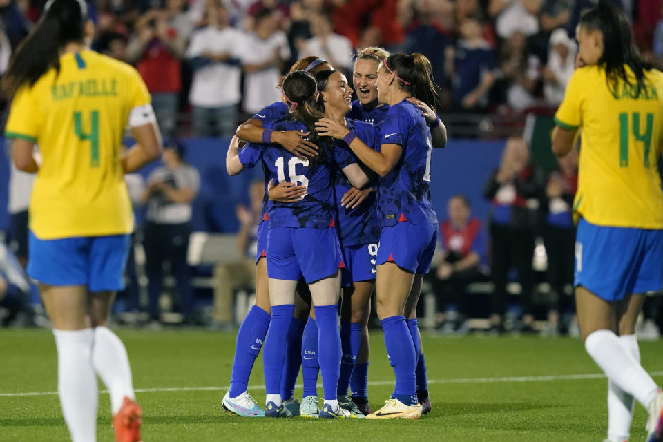 United States forward Mallory Swanson, centr, celebrates her goal with Rose Lavell (16), Anti Sullivan (17) and other teammates during the second half of a SheBelieves Cup soccer match against Brazil Wednesday, Feb. 22, 2023, in Frisco, Texas. The United States won 2-0. (AP Photo/LM Otero)