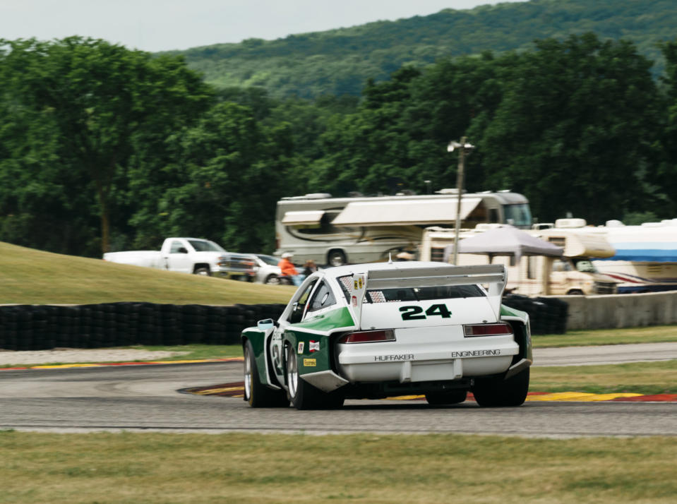 <p>There's a viewing spot on the outside of Turn 7—unglamorously between a port-a-potty and a trash can, where you stand eye level with the track surface and can look straight through the apex. From there you can watch the cars turn-in, roll slightly, change direction and maybe even induce some slip from the rear as they make their way around. You're low enough to see daylight under the race cars and close enough to hear the tires. You can see the suspension at work, and pick out which drivers are committed, and who's using the curbs. The best part is that like most of the great spots at Road America, you don't need special accreditation to see this, it's open to everyone. </p>