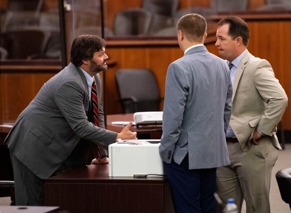 Josh Kendrick, left, attorney for the plaintiff, talks with Daniel Plyler, attorney for SCDC and his team during  the trial regarding the state's death penalty, at Richland County Courthouse, in Columbia, Tuesday, August 2, 2022. 