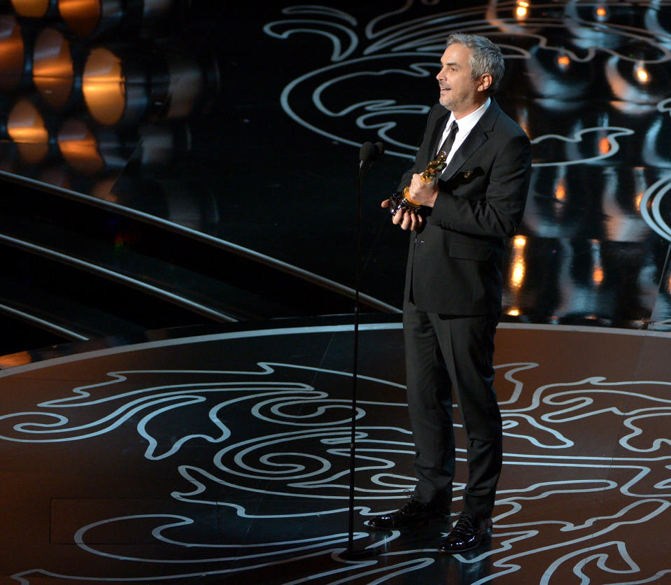 Alfonso Cuaron accepts the award for best director of the year for "Gravity" during the Oscars at the Dolby Theatre on Sunday, March 2, 2014, in Los Angeles. (Photo by John Shearer/Invision/AP)