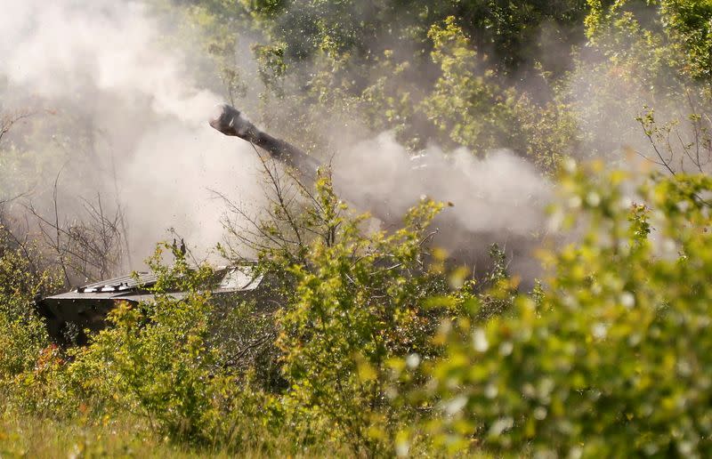 A howitzer of pro-Russian troops fires in the Luhansk region