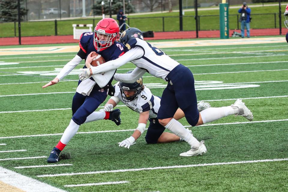 Skaneateles' Nathan Shattuck and Grayson Brunelle try to tackle Chenango Forks' Grady Stark during the Class C state quarterfinals.