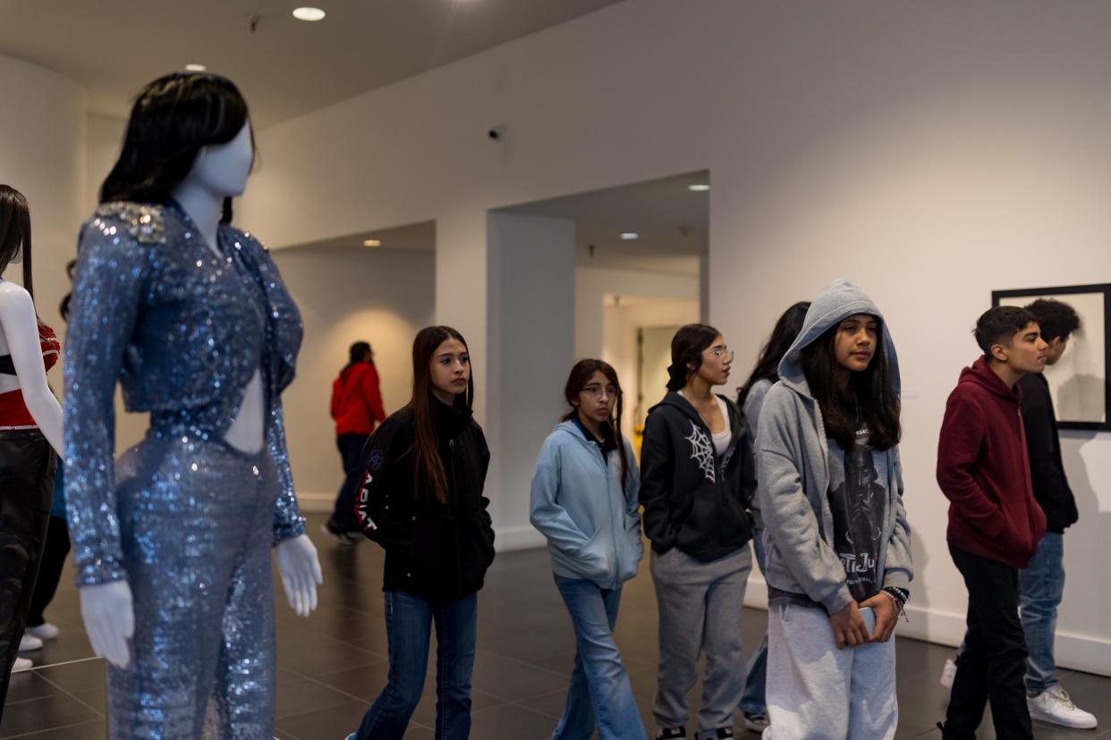 Art students at East Montana Middle get a tour by Ivan I. Calderon, Museum Art School Coordinator, of the exhibit “Selena Forever/Siempre Selena,” honoring Selena Quintanilla-Pérez, the late Queen of Tejano Music. The exhibit features portraits by photographer John Dyer and memorabilia from fans. It will run through Feb. 9, 2025, at the El Paso Museum of Art.