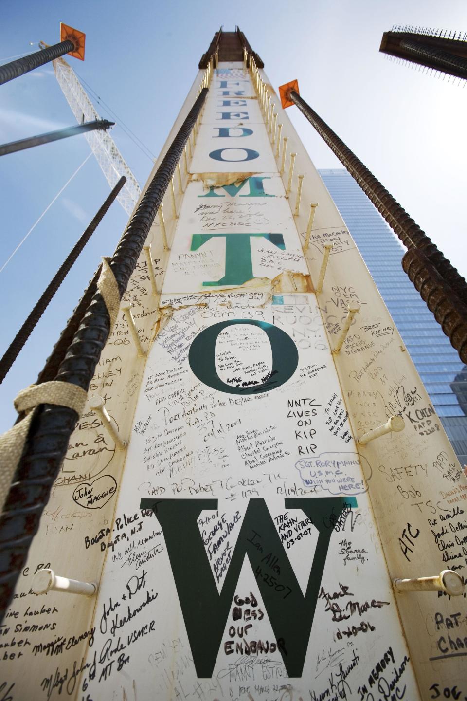 FILE- In this May 30, 2007 file photo, a steel column for the Freedom Tower bears signatures of Sept. 11 victims' family members at the World Trade Center in New York. Their signatures join those left by some who worked on the towers. Construction workers have left personal messages on One World Trade Center in the form of graffiti. (AP Photo/Mark Lennihan, File)