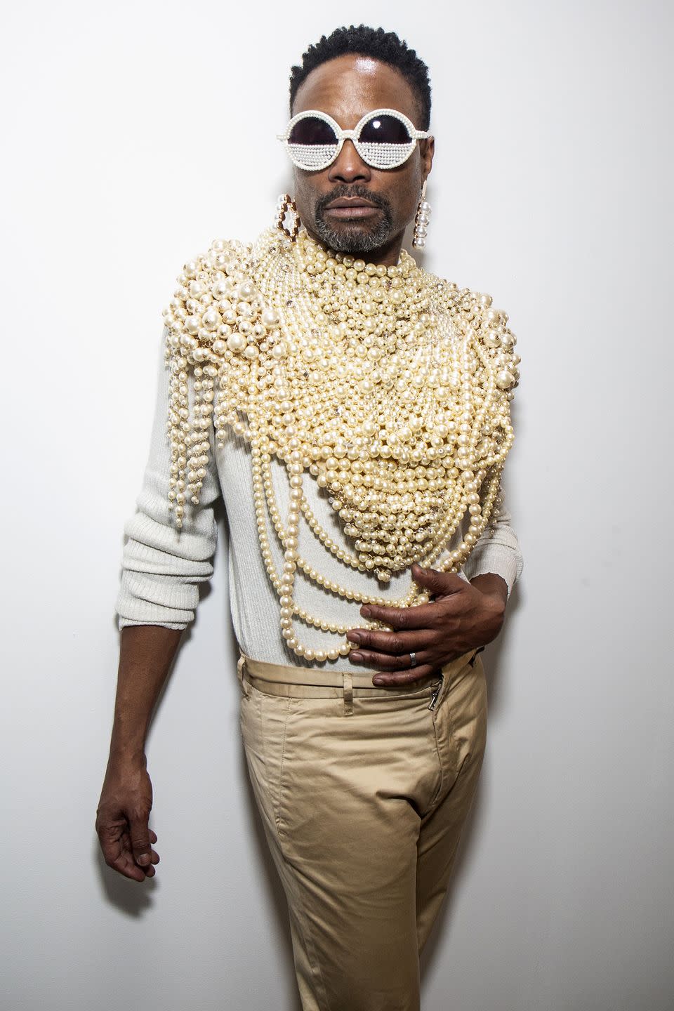 <p>At NYFW show at Spring Studios, Porter wore the brand's pearl necklace, taking his gold-coloured trousers, white long-sleeved jumper and white pearl-encrusted sunglasses ensemble to the next level. </p>