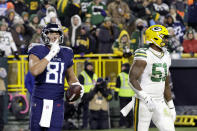 Tennessee Titans tight end Austin Hooper (81) celebrates his touchdown catch in front of Green Bay Packers linebacker Krys Barnes (51) during the second half of an NFL football game Thursday, Nov. 17, 2022, in Green Bay, Wis. (AP Photo/Mike Roemer)