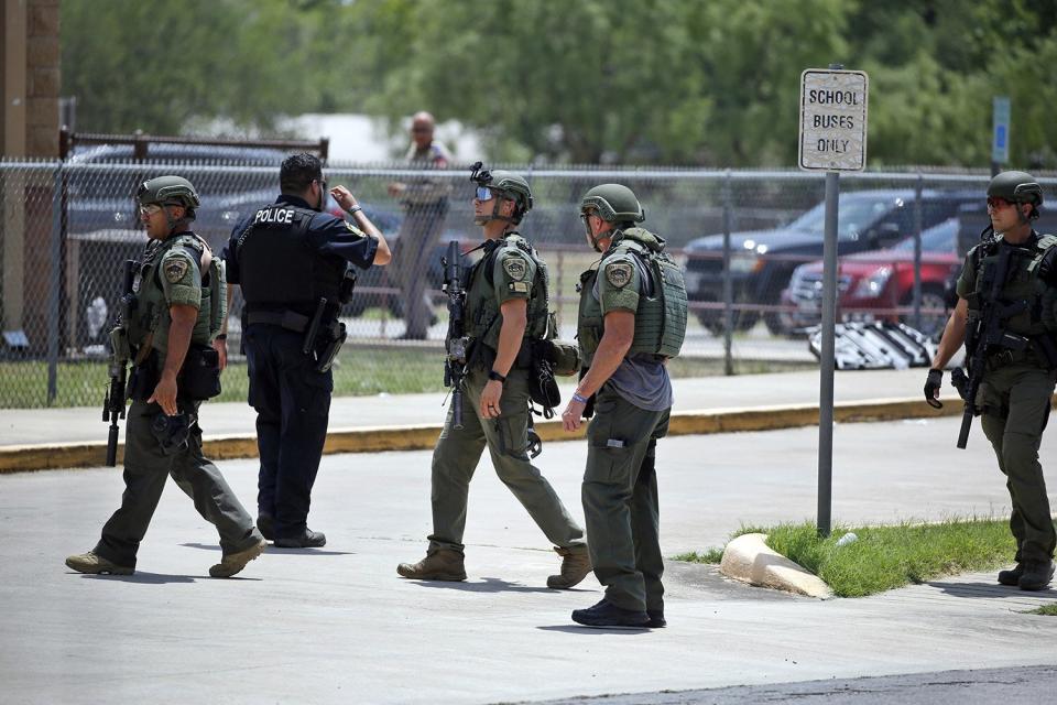 aw enforcement personnel stand outside Robb Elementary School following a shooting, in Uvalde, Texas Texas School Shooting, Uvalde, United States - 24 May 2022