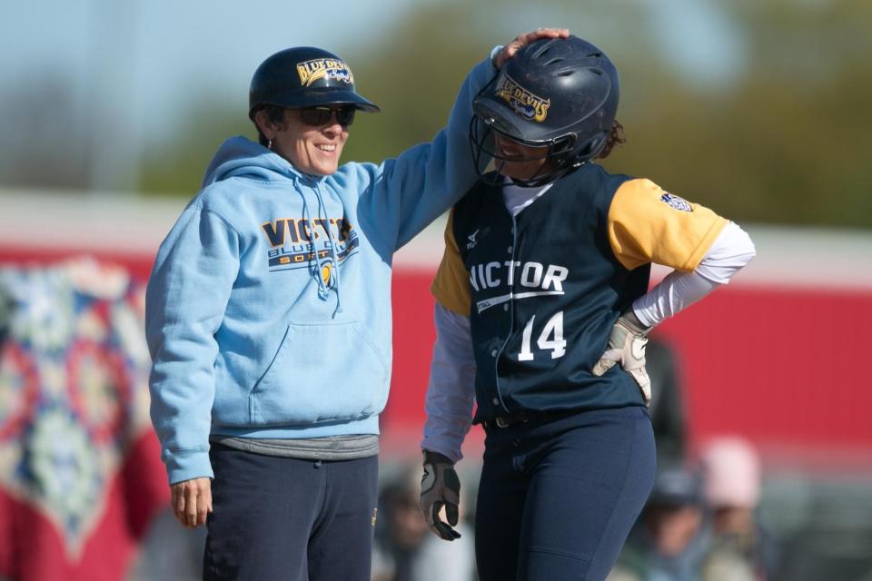 Shelly Collins, left, has coached one softball and three girls volleyball state champion teams. The Victor girls softball team also won eight Section V championships with Collins as coach.