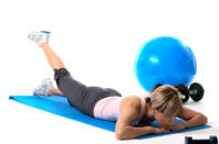 <div class="caption-credit"> Photo by: getty</div><b>Alternating arm and leg lift Works:</b> lower back A. Lie face down on the mat with your arms fully extended in front of you, thumbs pointing toward the ceiling. Engage the core to avoid collapsing in the back and keep the neck extended. B. At the same time, lift your right arm and left leg toward the ceiling, keeping them both extended. Keep both hips on the mat throughout the movement. Hold the position for 3 seconds. C. Return to starting position and repeat with the left arm and right leg for one repetition.