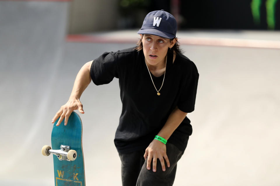 Alexis holding her skateboard at the x games