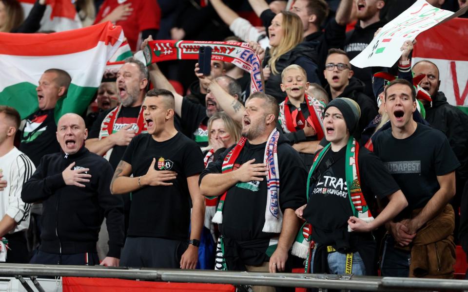 LONDON, ENGLAND - OCTOBER 12: Hungary fans sing the national anthem before the 2022 FIFA World Cup Qualifier match between England and Hungary at Wembley Stadium on October 12, 2021 in London, England. (Photo by Charlotte Wilson/Offside/Offside via Getty Images) - Charlotte Wilson/Offside 