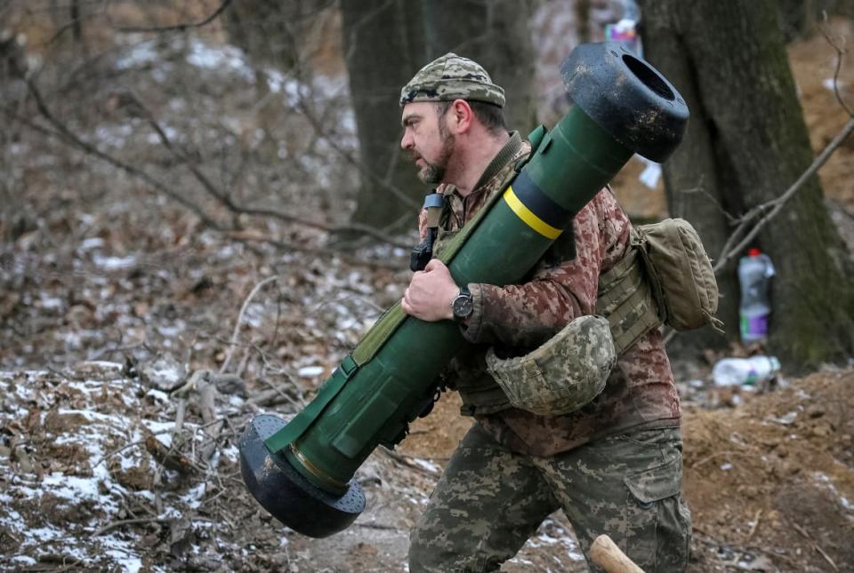 <div class="inline-image__caption"><p>A Ukrainian service member holds a Javelin missile system at a position on the front line in the north Kyiv region.</p></div> <div class="inline-image__credit">Gleb Garanich/Reuters</div>