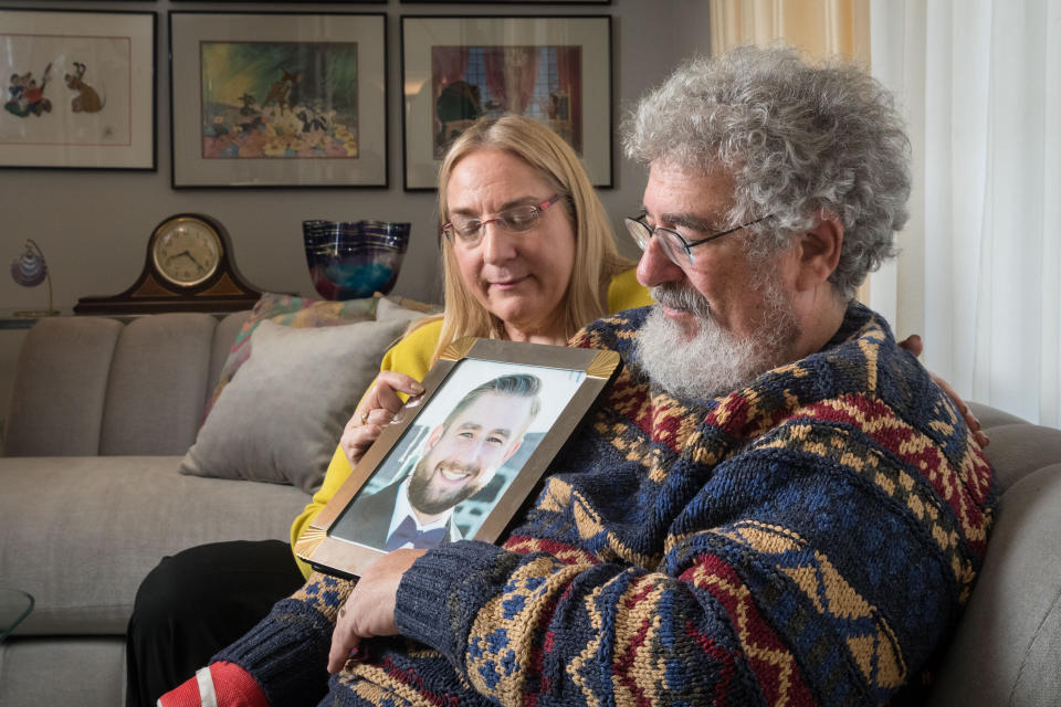 Mary Rich and her husband, Joel Rich hold a photo of their son in their home in Omaha, Nebraska, on Jan. 11, 2017. (Photo: The Washington Post via Getty Images)