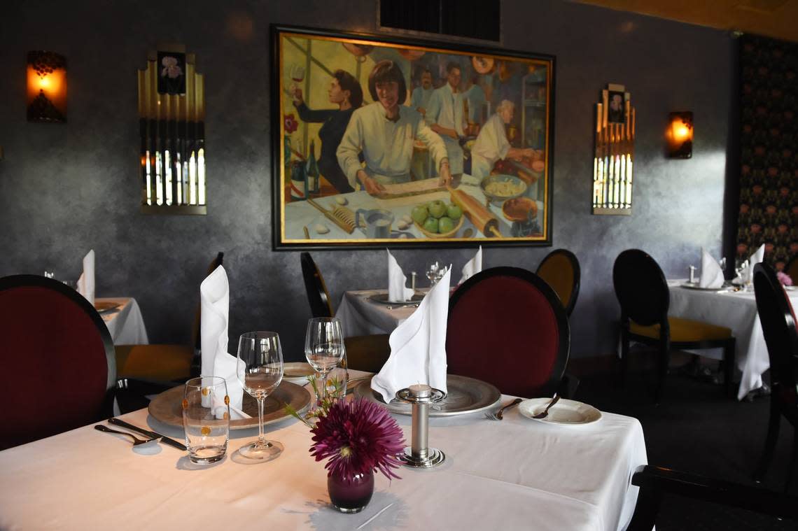 A dining room featuring a painting with founder Erna Kubin-Clanin and her daughter is pictured in this 2019 Fresno Bee file photo at The Elderberry House.