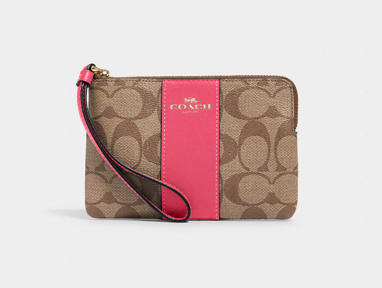 Corner Zip Wristlet In Signature Canvas. Image via Coach Outlet.