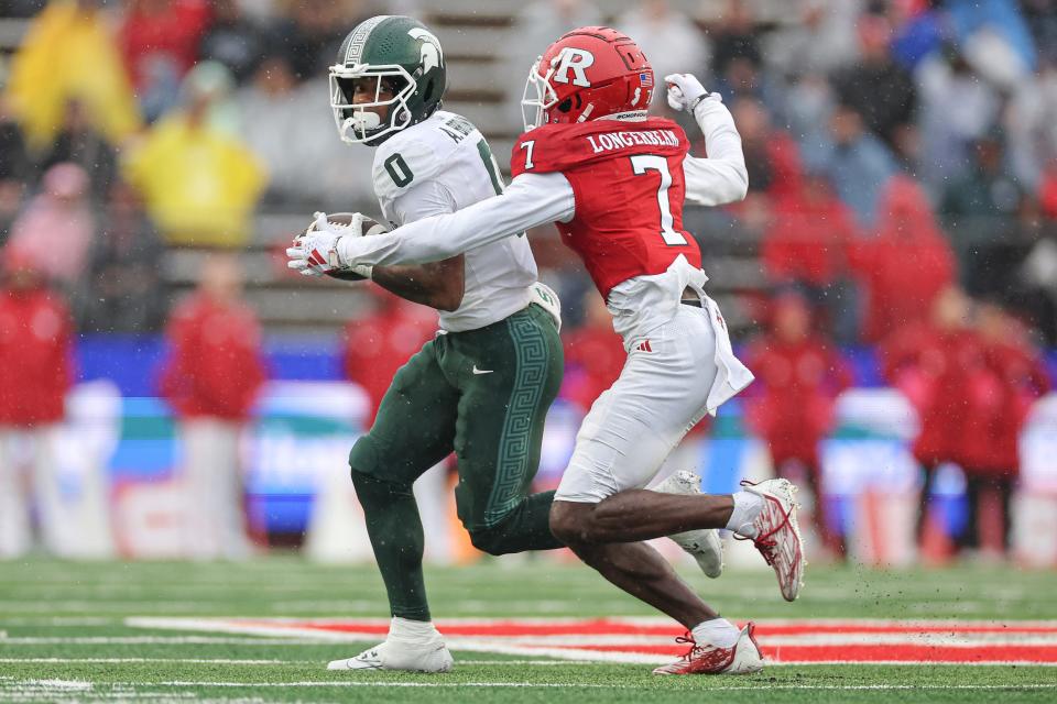 Oct 14, 2023; Piscataway, New Jersey, USA; Michigan State Spartans wide receiver Alante Brown (0) is tackled by Rutgers Scarlet Knights defensive back Robert Longerbeam (7) during the first half at SHI Stadium. Mandatory Credit: Vincent Carchietta-USA TODAY Sports