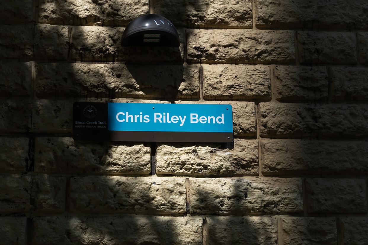 A sign identifying ‘Chris Riley Bend' is seen on the Shoal Creek Trail between Fifth and West streets on July 16.