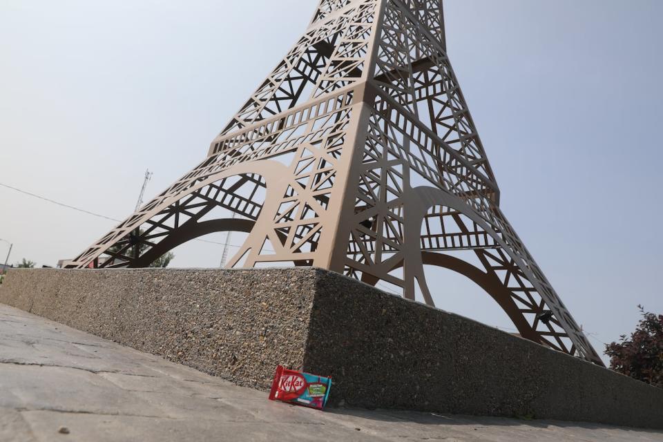 A KitKat chocolate bar sits in front of a replica of the Eiffel Tower in the Village of Montmartre. 