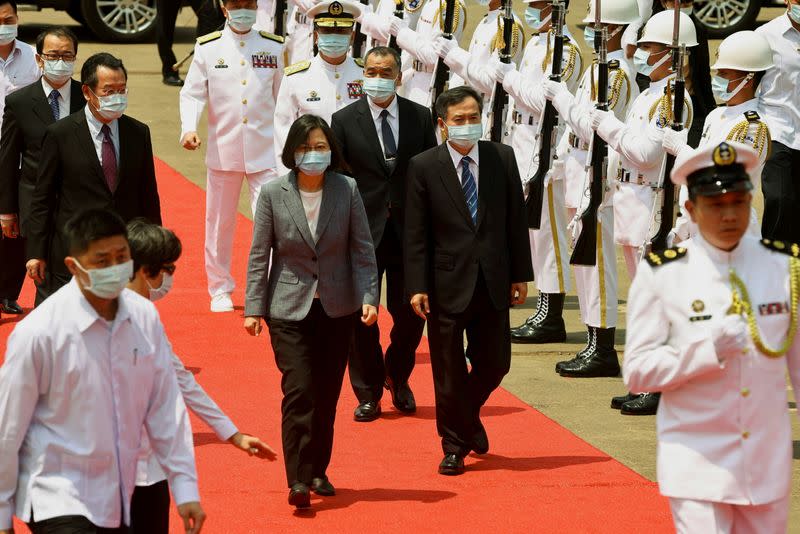 Taiwan's President Tsai Ing-wen and CSBC Corporation Chairman Cheng Wen-Lon arrive at the launch ceremony for Taiwan Navy's domestically built amphibious transport dock "Yushan" in Kaohsiung