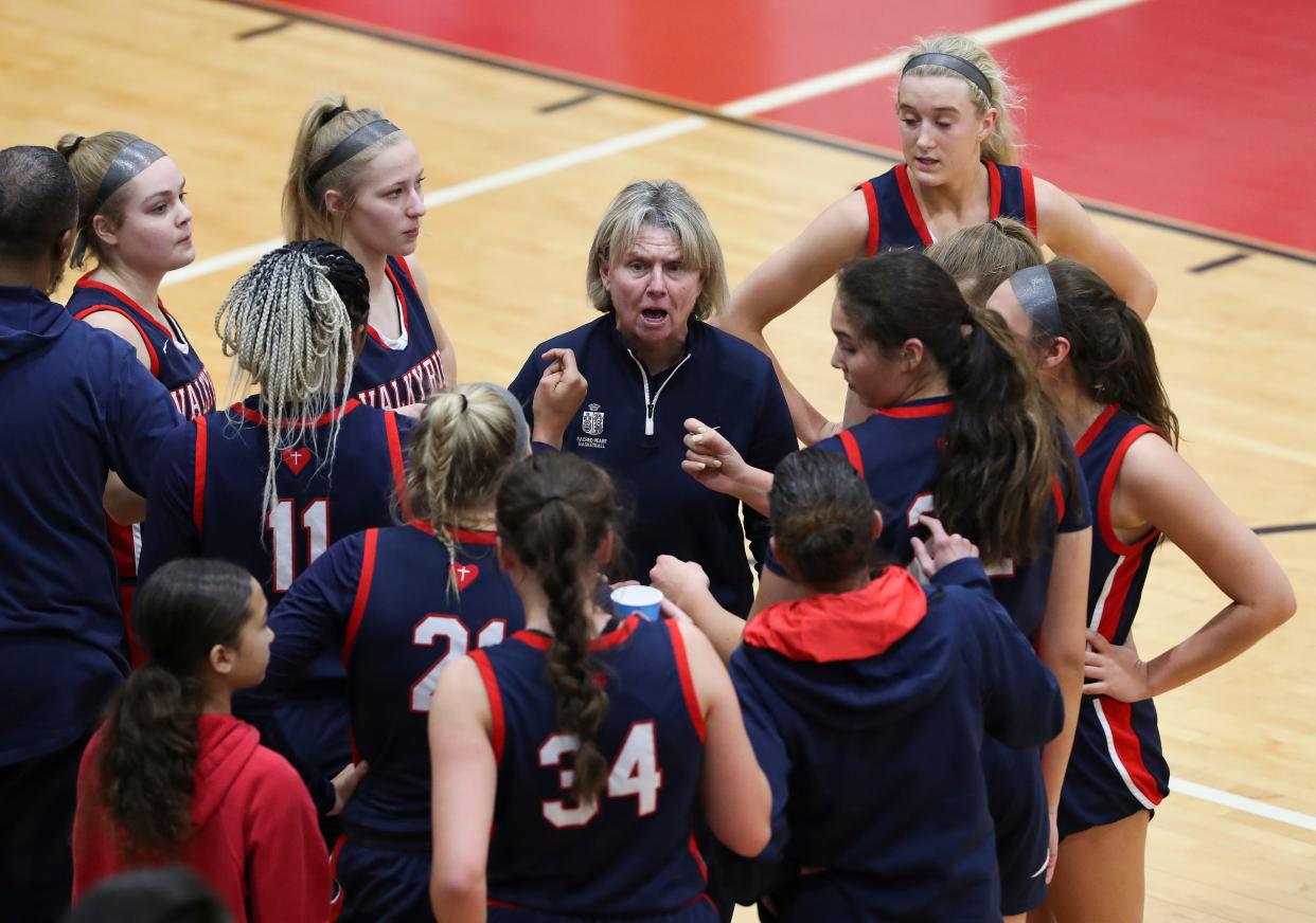 Sacred Heart head coach Donna Moir instructs her team against Bullitt East during their game in the Queen of the Commonwealth tournament at the Bullitt East High School in Mt. Washington, Ky. on Dec. 22, 2021.  Sacred Heart won  69-59.