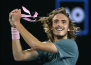 Greece's Stefanos Tsitsipas celebrates after defeating Switzerland's Roger Federer in their fourth round match at the Australian Open tennis championships in Melbourne, Australia, Sunday, Jan. 20, 2019. (AP Photo/Mark Schiefelbein)