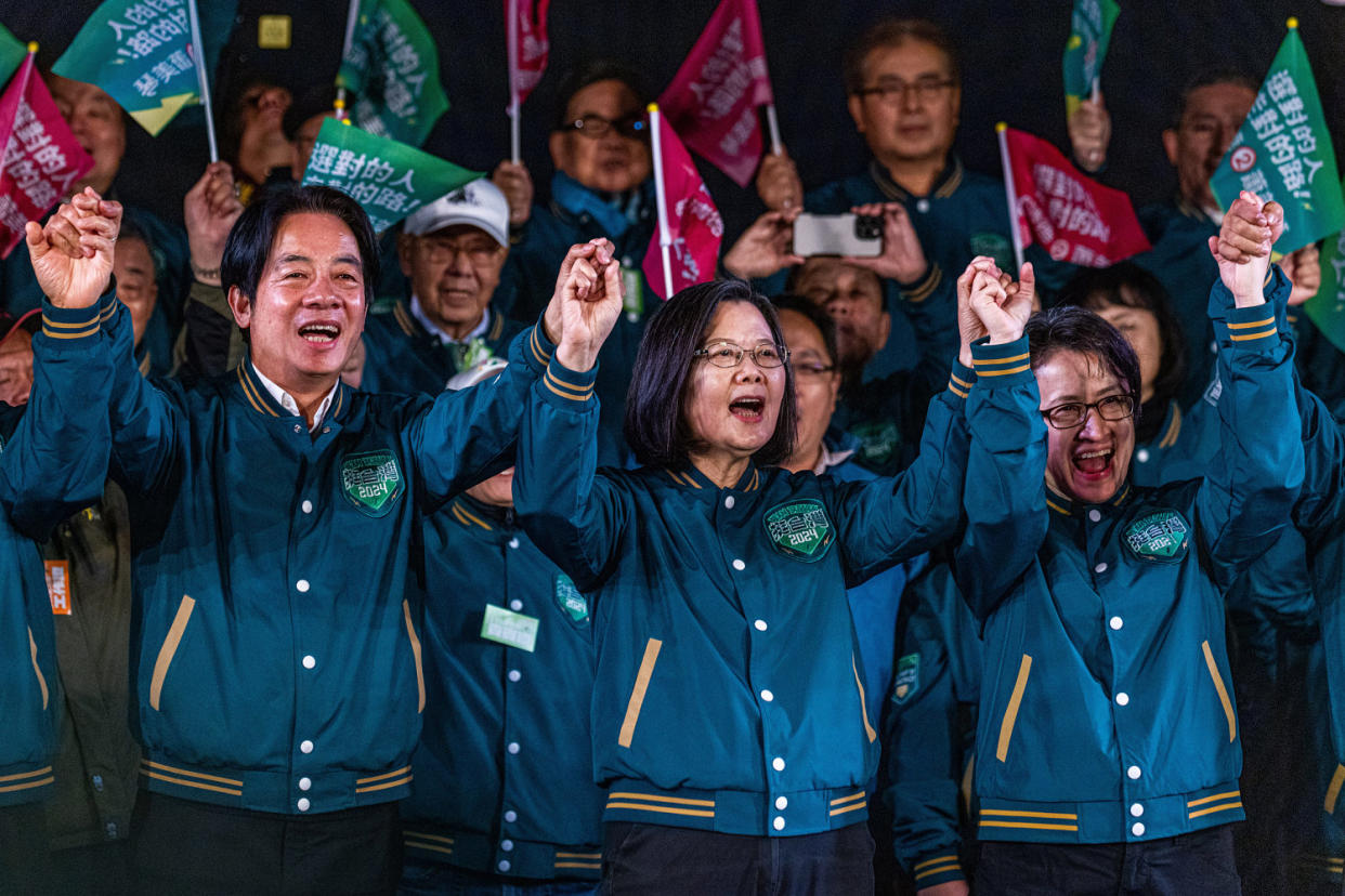 Democratic Progressive Party  presidential candidate Lai Ching-te, his running mate Hisao Bi-khim and Taiwan's President Tsai Ing-wen, center, at a rally on Jan. 11, 2024 in Taipei. (Annabelle Chih / Getty Images)