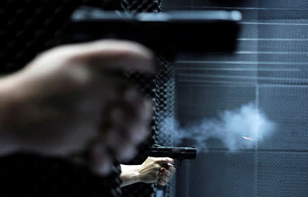 People fire handguns at the 1911 Shooting Club in Sao Paulo, Brazil, January 11, 2019. Picture taken January 11, 2019. REUTERS/Nacho Doce