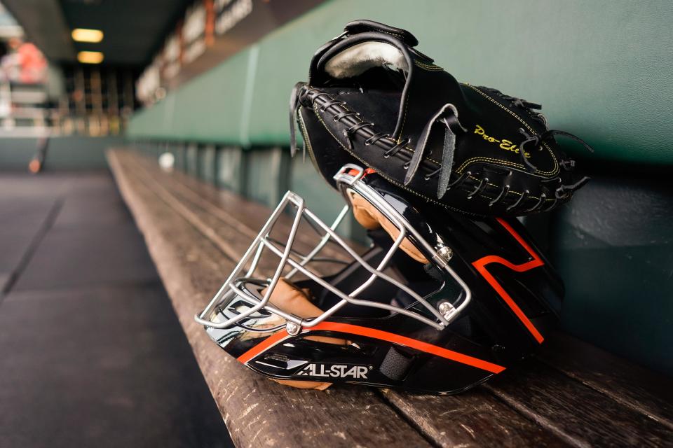 A catcher's helmet in the San Francisco Giants dugout at Oracle Park.