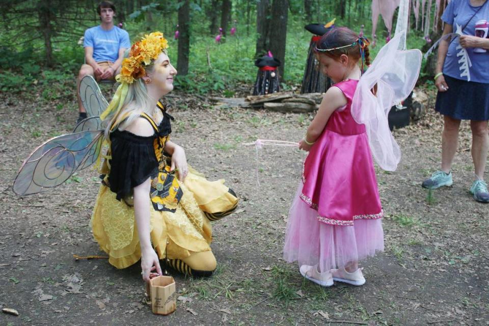 Kansas City Renaissance Festival performer Hannah Rames chats with Abigail Hoehn, 6, of Shawnee at the Overland Park Arboretum’s Enchanted Faire.