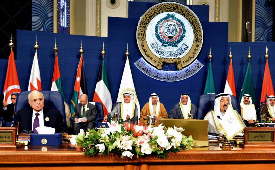 Emir of Kuwait, Sheikh Sabah al-Ahmad al-Sabah, right, and Secretary-General of the League of Arab States, Nabil El Araby, left, attend the closing session of the Arab League Summit at Bayan Palace, Kuwait, Wednesday, March 26, 2014. (AP Photo/Nasser Waggi)