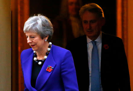Britain's Prime Minister Theresa May and Chancellor of the Exchequer Philip Hammond leave 10 Downing Street, in London, Britain, 31 October, 2018. REUTERS/Henry Nicholls