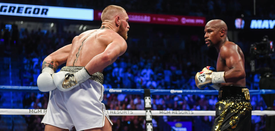 Nevada , United States - 26 August 2017; Conor McGregor, left, and Floyd Mayweather Jr during their super welterweight boxing match at T-Mobile Arena in Las Vegas, USA. (Photo By Stephen McCarthy/Sportsfile via Getty Images)