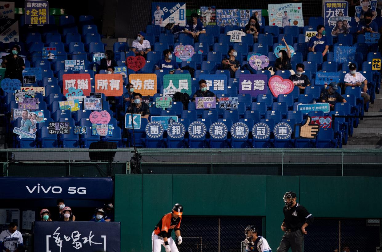 A crowd watches a baseball game between Fubon Guardians and Uni-Lions at the Xinzhuang Baseball Stadium in New Taipei City, Taiwan on May 8, 2020. The Chinese Professional Baseball League (CPBL) allowed 1,000 fans into the stadium for the first time after the new season started behind closed doors.