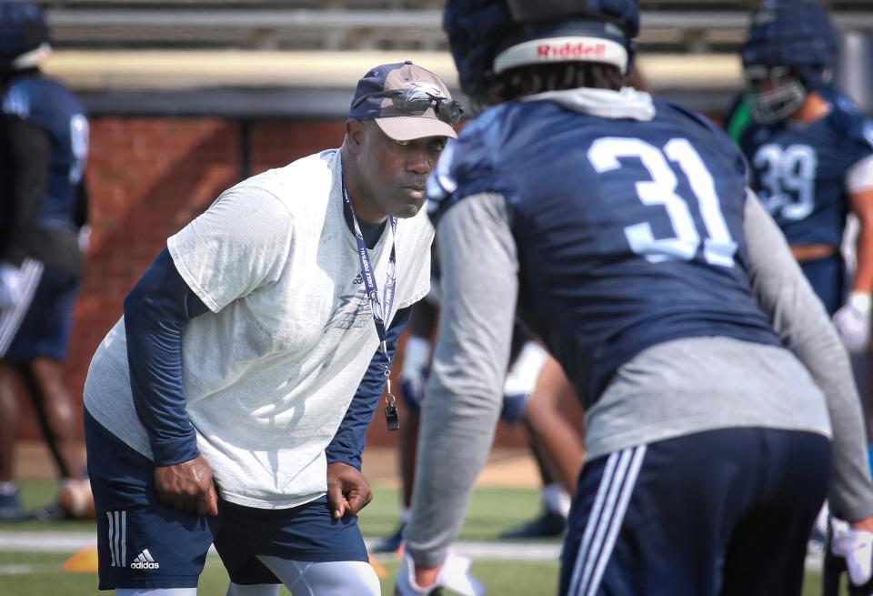 Georgia Southern assistant head coach/cornerbacks Kevin Whitley, a former Eagles player and 2021 interim head coach, eyes defensive back Chase Dial-Watson's (31) technique at practice Aug. 4, 2022 at Paulson Stadiium in Statesboro.