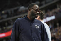 Golden State Warriors forward Draymond Green takes a seat on the bench in the second half of an NBA basketball game against the Denver Nuggets Thursday, Feb. 2, 2023, in Denver. (AP Photo/David Zalubowski)