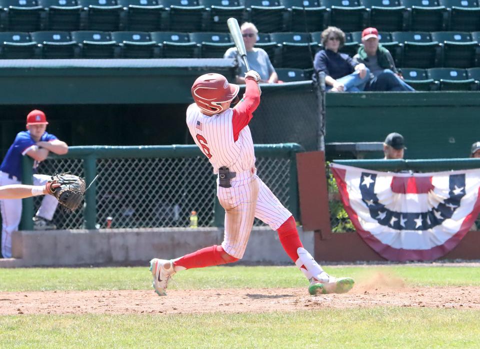 CVU's Travis Stroh watches his home run head for the left field wall during the Redhawks 6-0 win over Mount Anthony in the D1 state championship game at Centennial Field on Saturday afternoon.