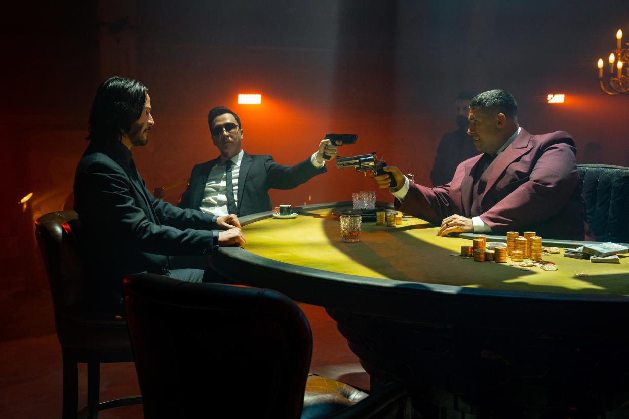 John Wick (Keanu Reeves, left) faces off with old friend Caine (Donnie Yen) and the colorful Killa (Scott Adkins) in "John Wick: Chapter 4."