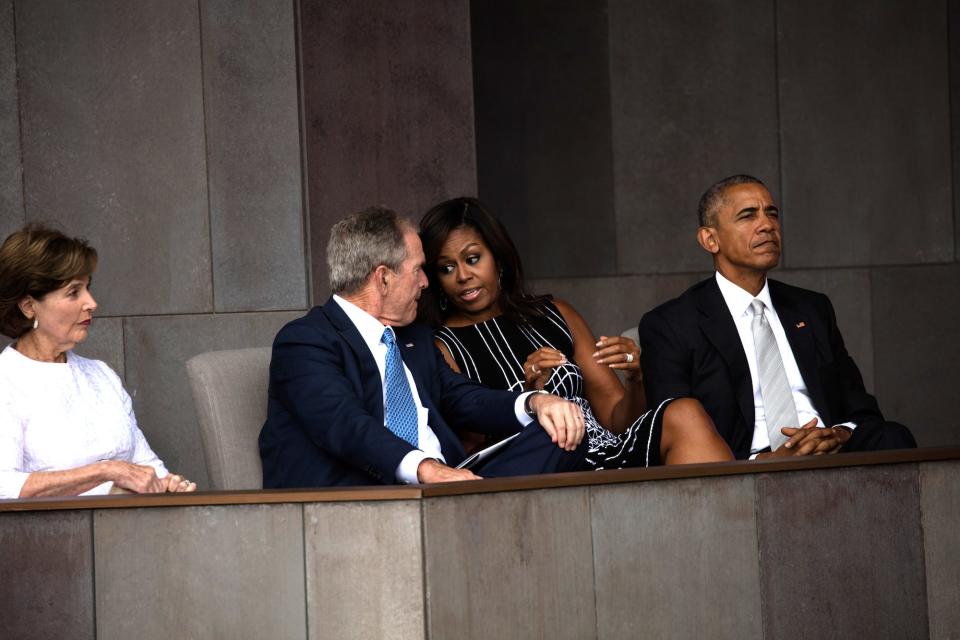 First Lady Laura Bush, former President George W Bush, First Lady Michelle Obama, and President Barack Obama as they attend the opening of the National Museum of African American History and Culture, Washington DC, September 24, 2016.